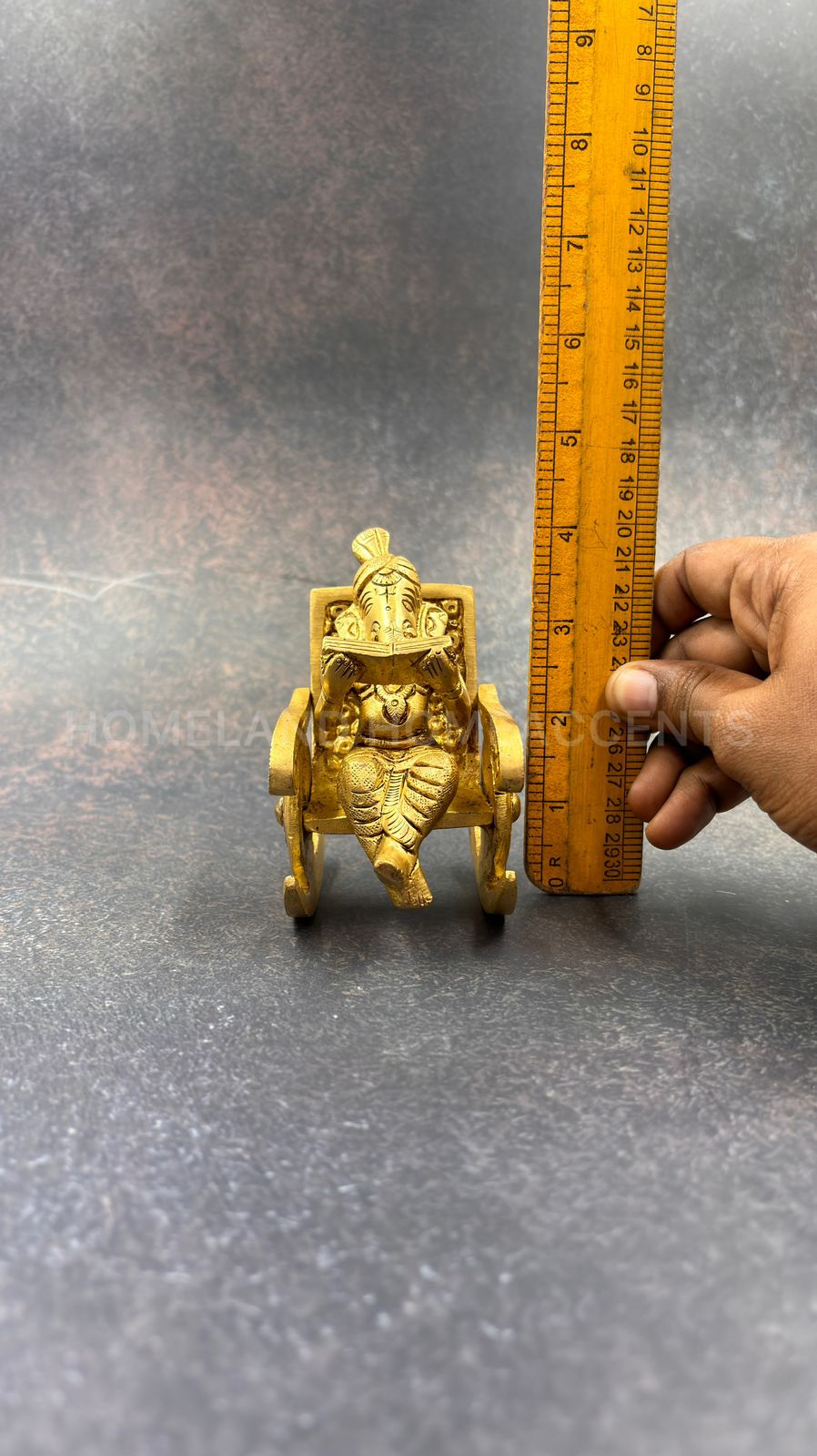 Brass Ganesh in rocking chair